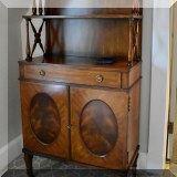 F26. Maitland Smith cabinet/bookcase. 49”h x 27”w x 17”d 